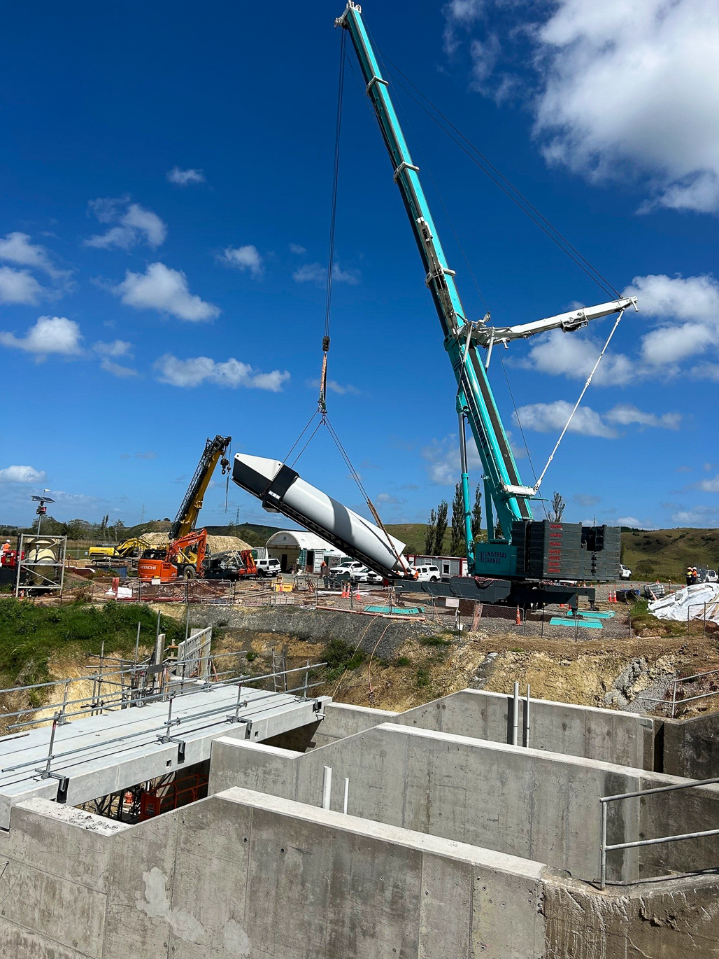 Crane lifting one of the 33t archimedes pumps into place