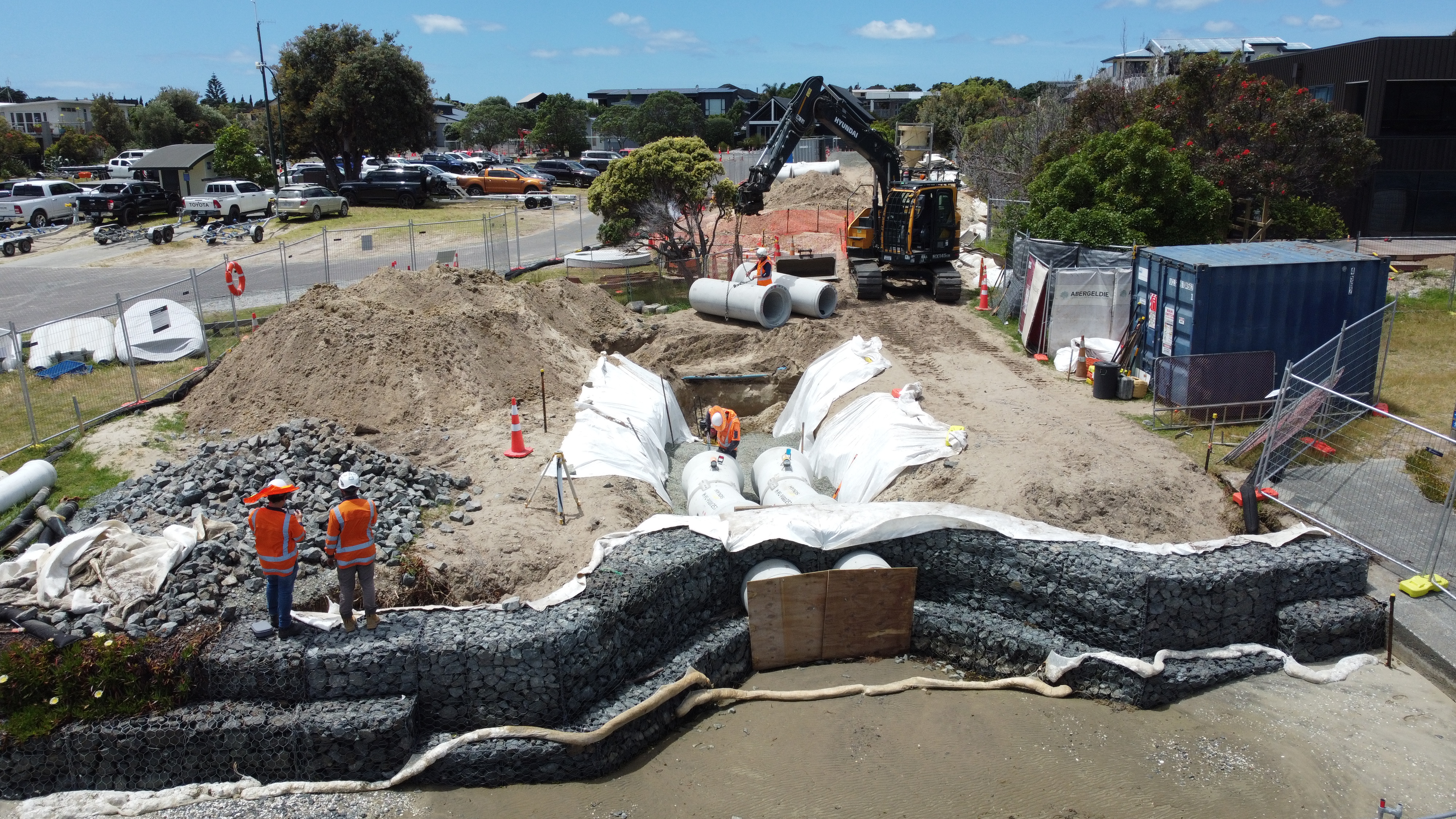 Construction of a gabion wall in a body water with environmental controls in place