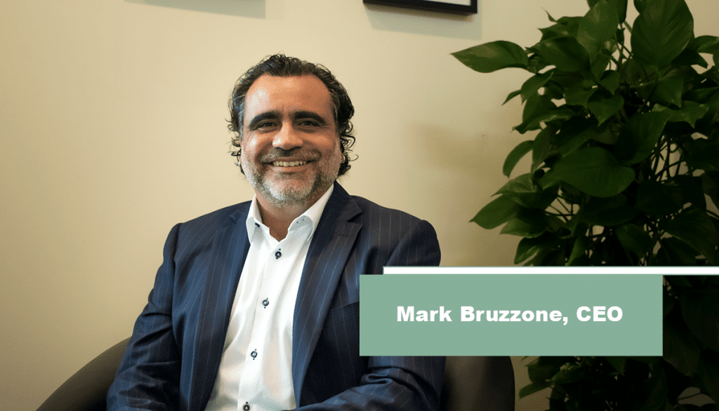 Mark Bruzzone sitting in his office