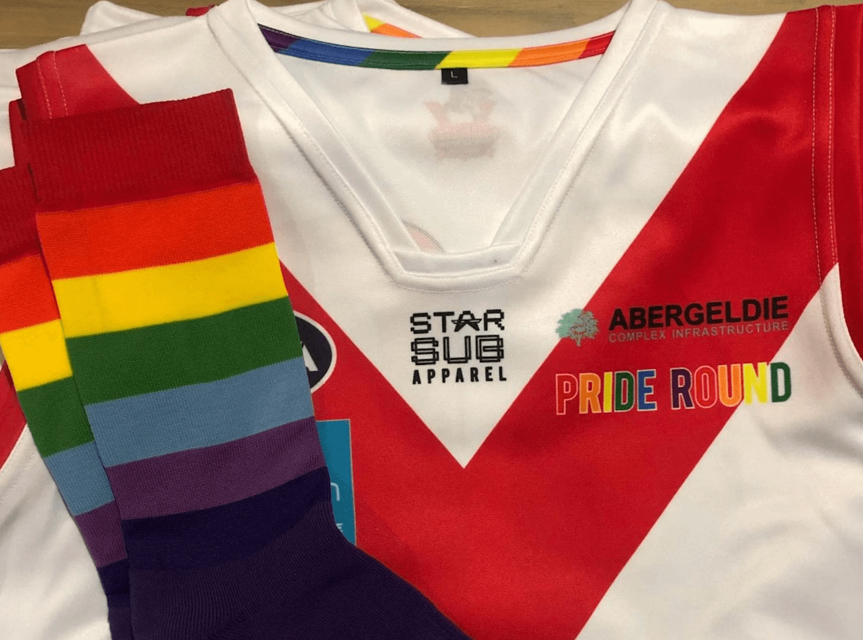 Abergeldie logo shirt in support of LGBTQIA Community