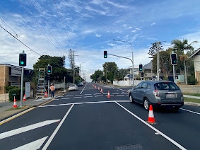 Vehicle driving on Vulture Street after completion of the signalised pedestrian crossing